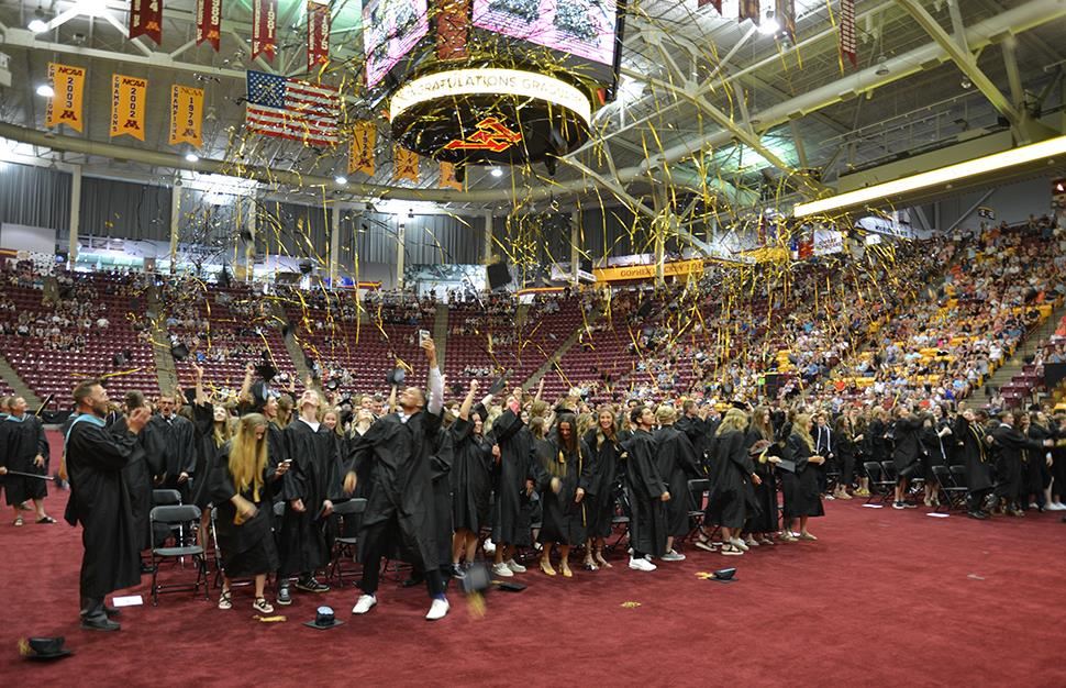 Andover High School graduates toss their hats