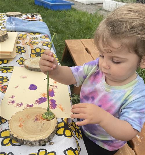 Child painting on wood