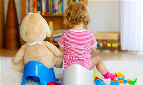 young child on potty chair