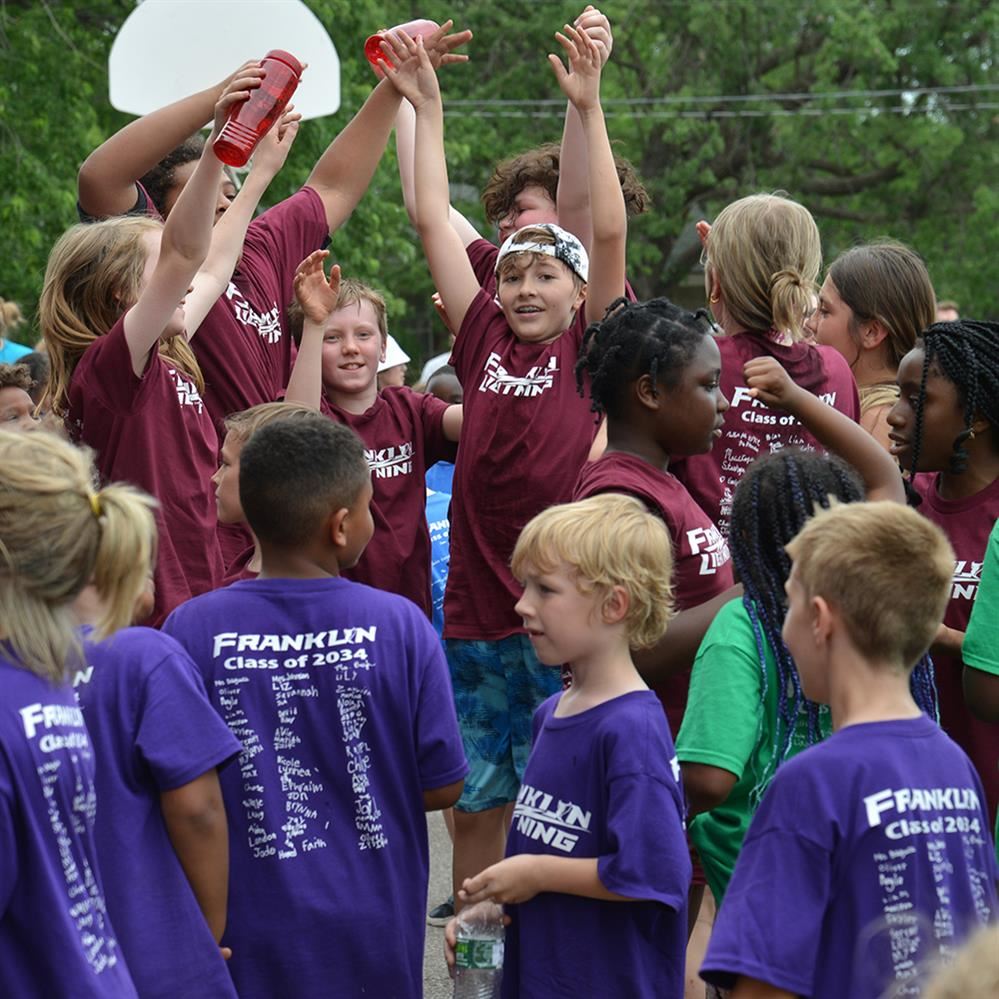  group of students jumping 