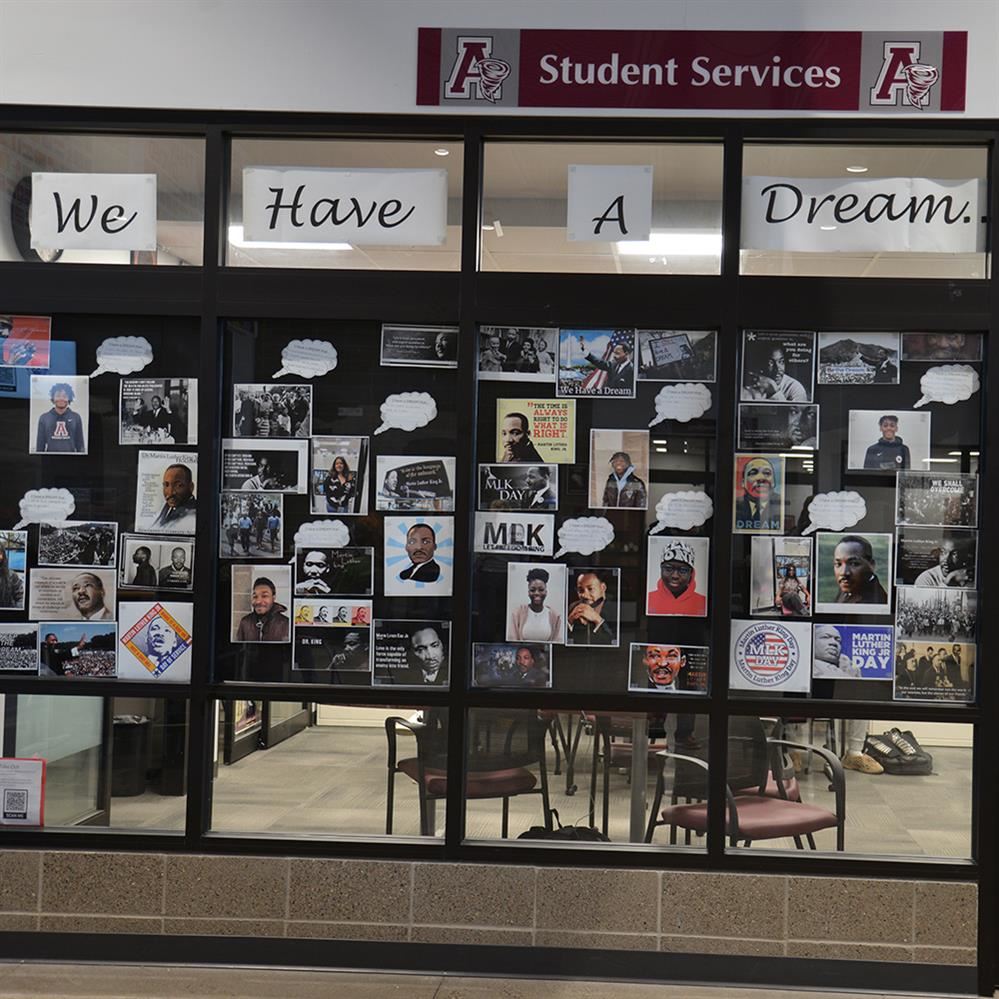 wall with images and quotes from MLK and students  