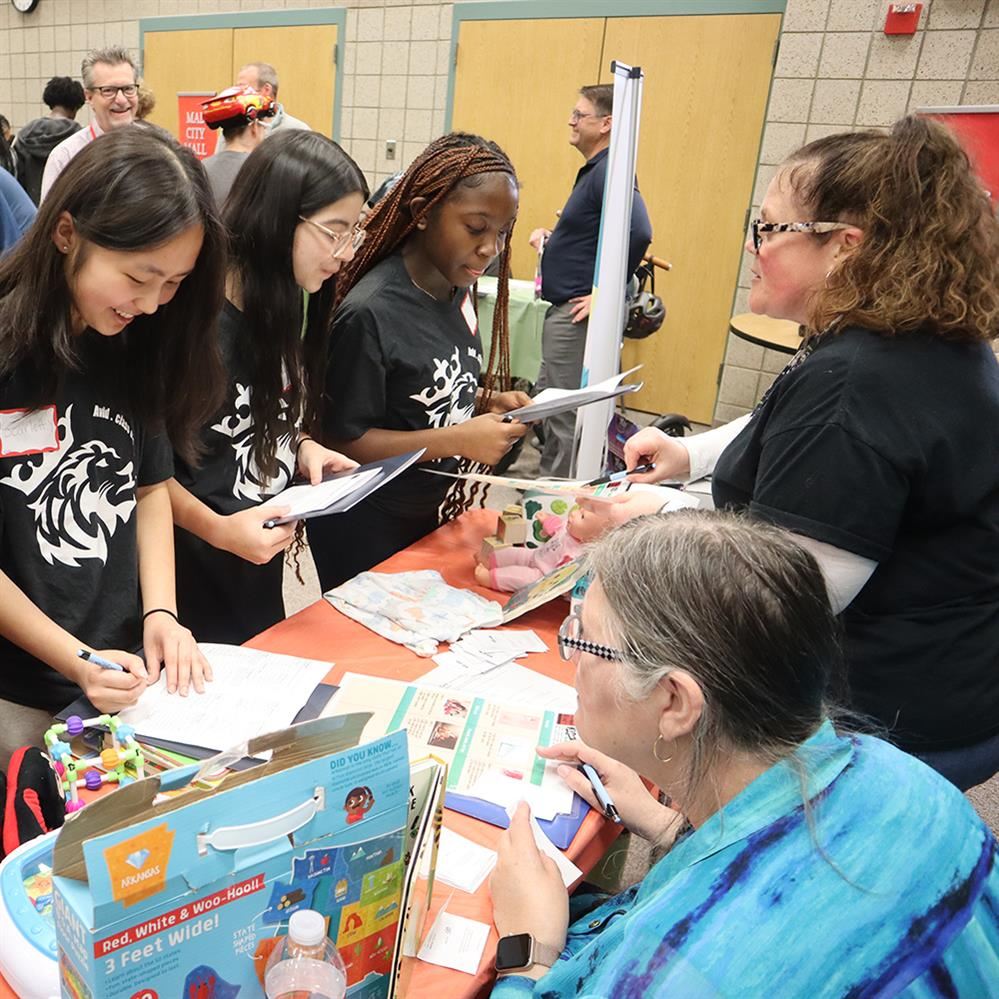  Students make household items purchases during financial literacy simulation