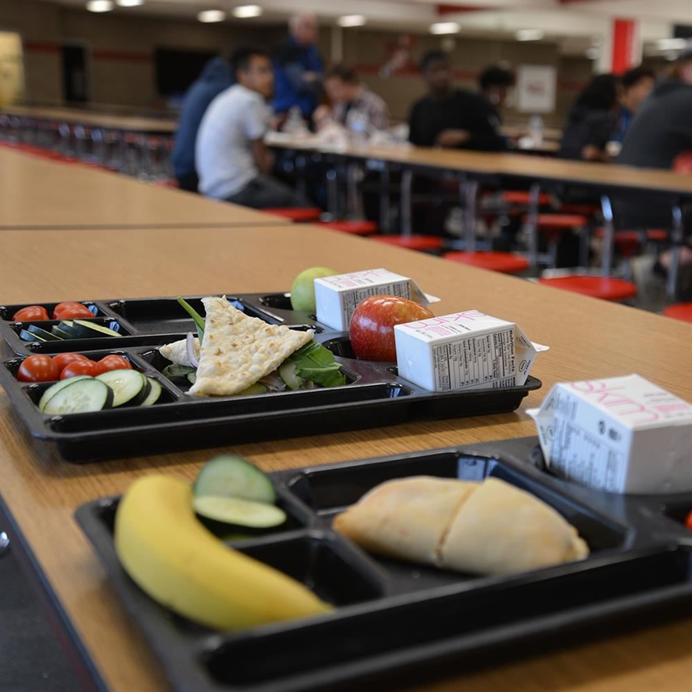  Food displayed on a tray on a cafeteria table