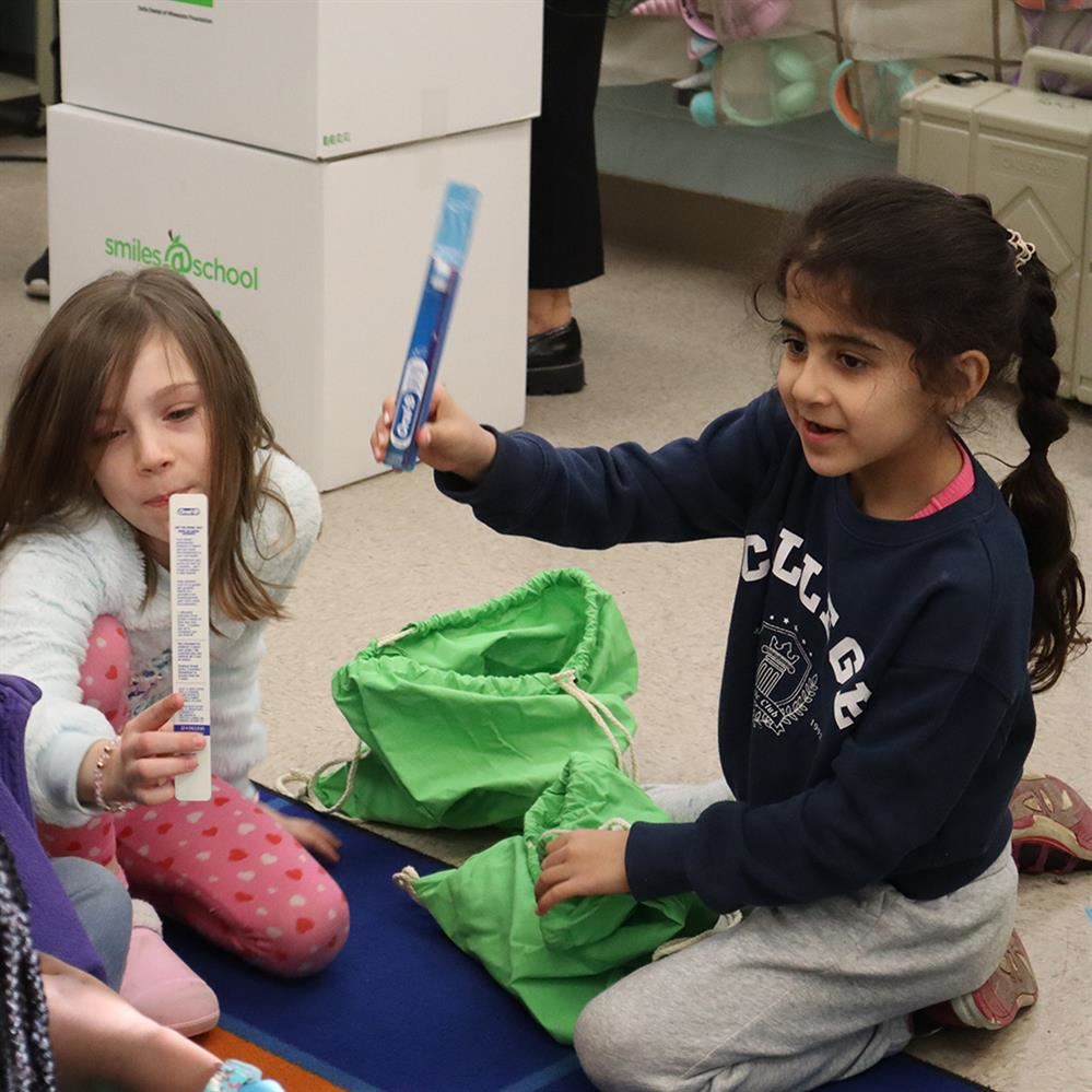 Adams Elementary students discover new toothbrushes in dental health kits